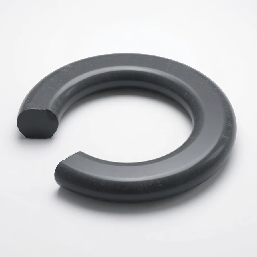 Cutaway O-ring showing flat parallel top and bottom surfaces caused by compression set