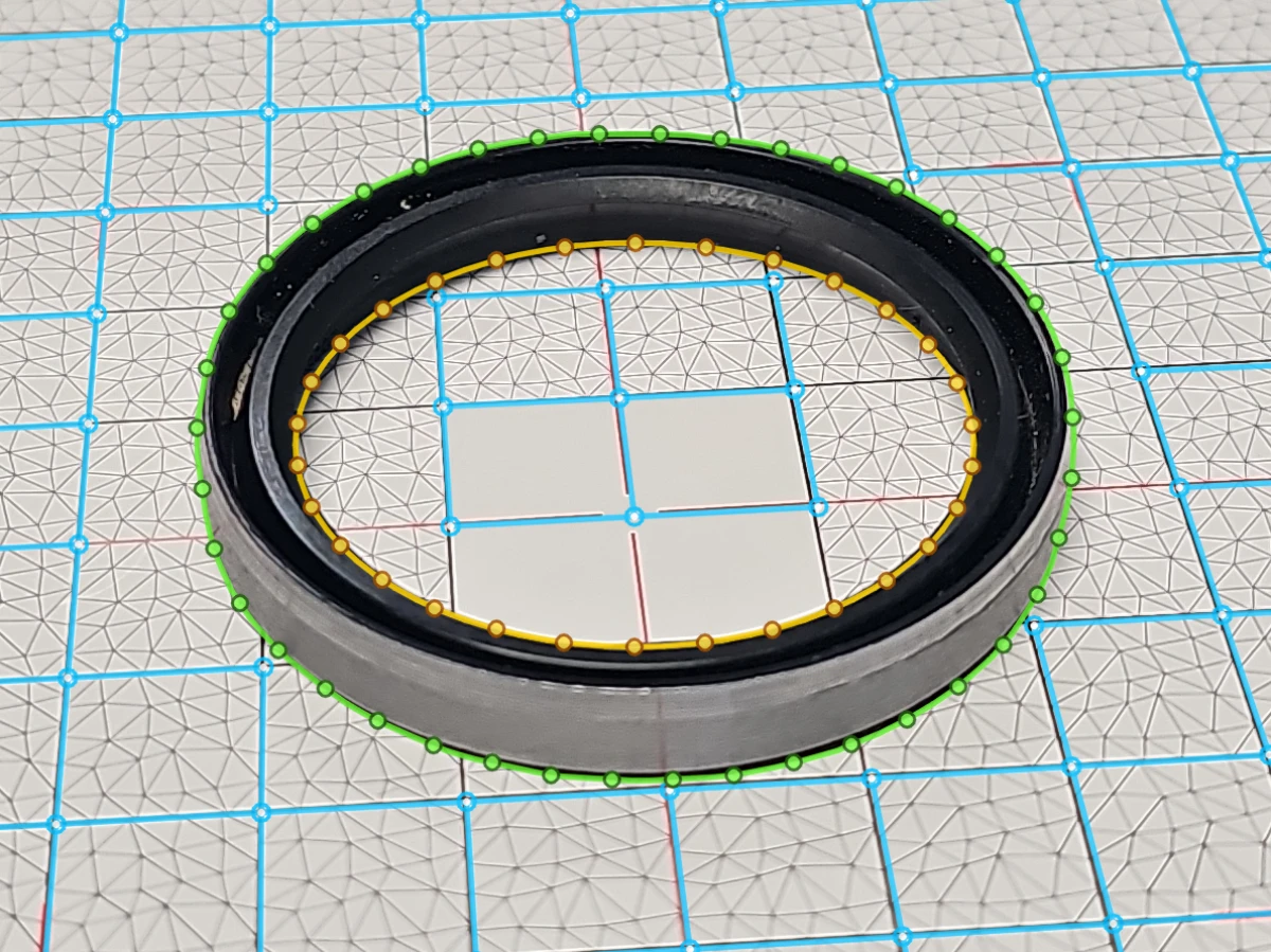 Oblique capture of a metal-cased TC rotary shaft seal on an Olypsys grid with solved grid lines and inner/outer contour points
